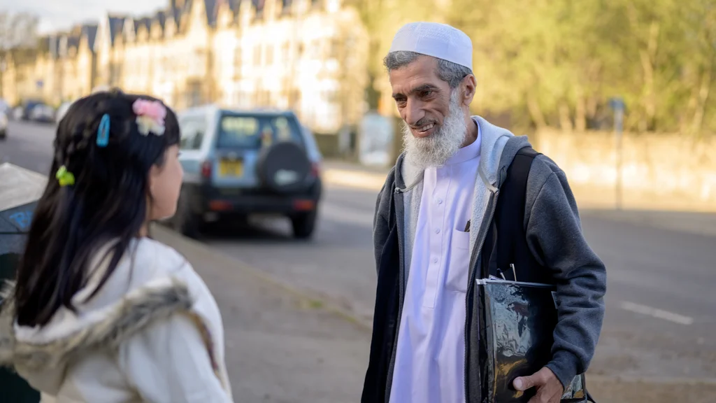 Older man on the street socialising