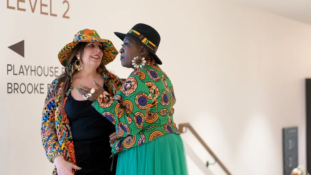 Two older women in colourful clothes