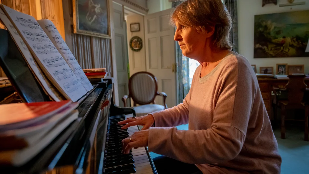 Older woman playing piano